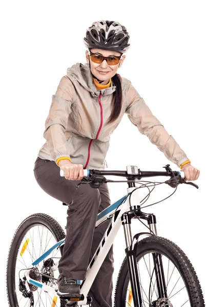 Attractive adult woman cyclist isolated on white background. — Stock Photo, Image