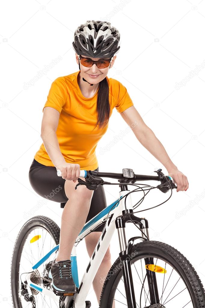 Attractive adult woman cyclist isolated on white background.