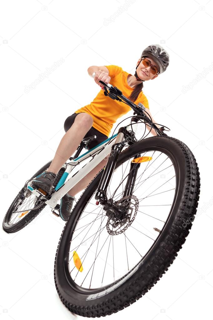 Attractive adult woman cyclist isolated on white background