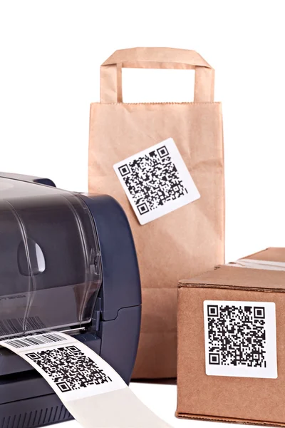 Barcode printer and packaging boxes marked with a bar code. Barc — Stock Photo, Image