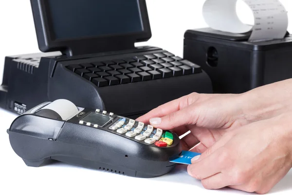 The seller takes payment by a cash register and credit card read — Stock Photo, Image