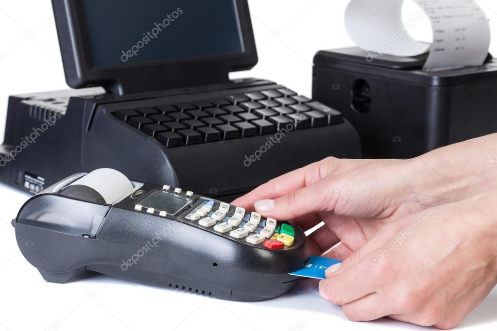 The seller takes payment by a cash register and credit card read