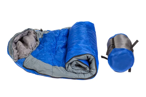 Zwei der gleichen Schlafsäcke in einem Kompressionsbeutel und auspacken — Stockfoto