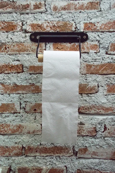 Roll Tissue In the bathroom, there is a brick wall. — Stock Photo, Image