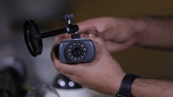 A man repairing security camera in service center