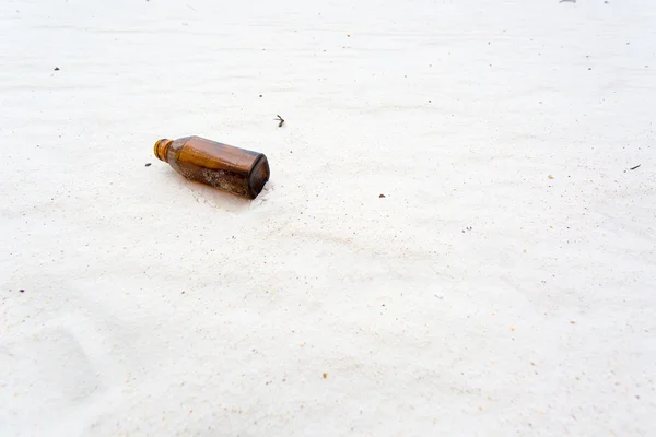 Bottle on the clean sand beach — Stock Photo, Image