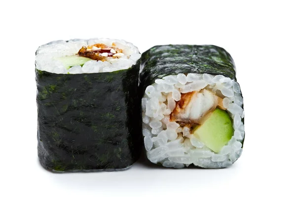 Dos rollos de sushi maki se cierran con anguila ahumada y pepino sobre fondo blanco — Foto de Stock