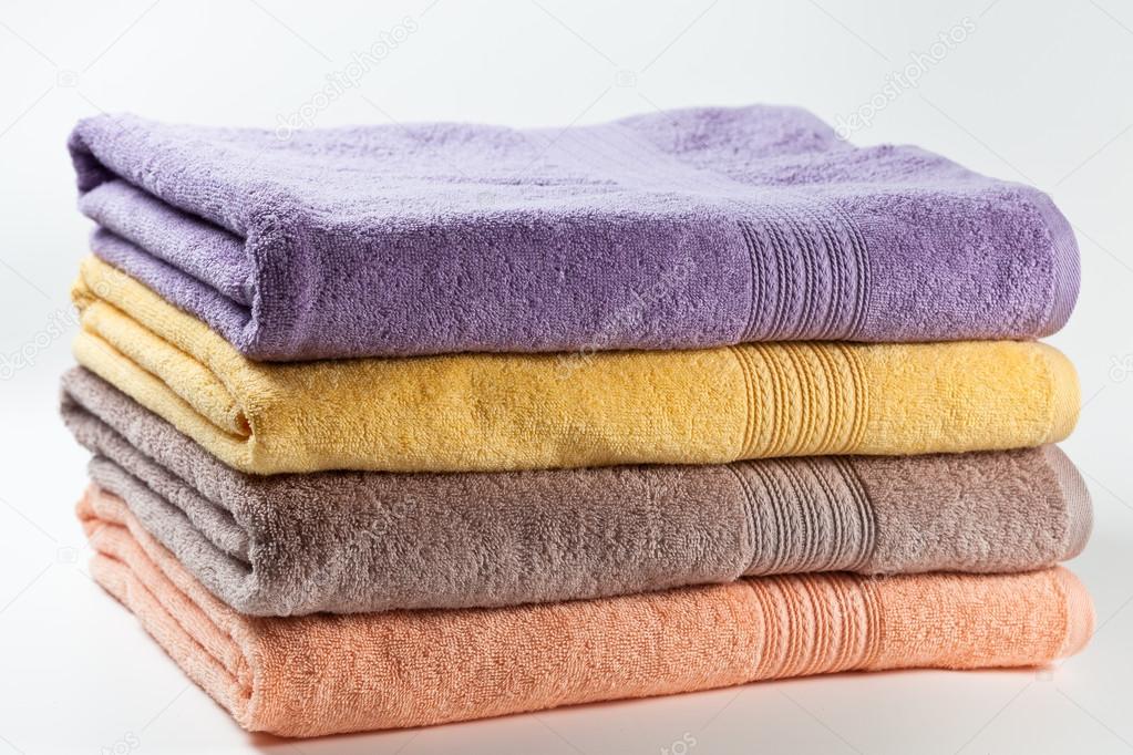 Colorful towels isolated on white background