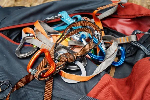 Rock climbing carabiners and others equipment in a bag