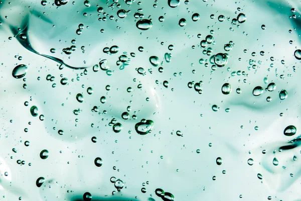 Gel de creme líquido, textura cosmética azul verde com bolhas — Fotografia de Stock