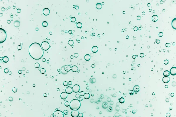 液体奶油凝胶，绿色蓝色化妆品质地，有气泡 — 图库照片