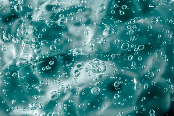 Gel líquido crema, textura cosmética azul verde con burbujas — Foto de Stock