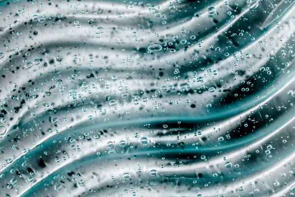 Gel líquido crema, textura cosmética azul verde con burbujas — Foto de Stock