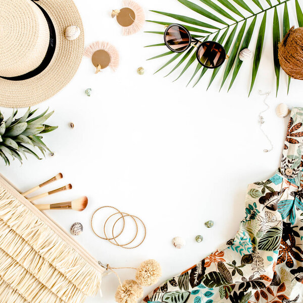 Female, summer street style. Womens frame of accessories. Dress, straw hat, bag, sunglasses and pineapple. Top view, flat lay.