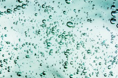 Sıvı krem jöle, köpüklü yeşil mavi kozmetik doku.