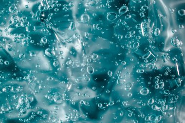 Sıvı krem jöle, köpüklü yeşil mavi kozmetik doku.