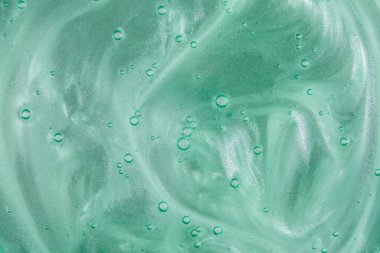 Sıvı krem jöle, köpüklü yeşil mavi kozmetik doku.