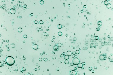 Sıvı krem jöle, köpüklü yeşil mavi kozmetik doku.