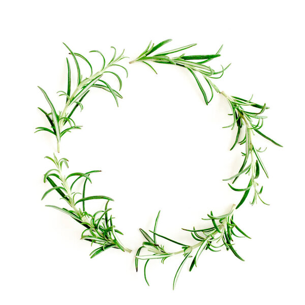 Round wreath frame made herbs, green branches, leaves rosemary. Flat lay. Top view.