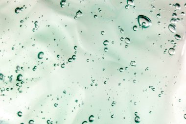 Sıvı krem jöle, köpüklü yeşil mavi kozmetik doku.