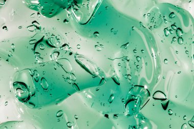 Sıvı krem jöle, köpüklü yeşil mavi kozmetik doku.