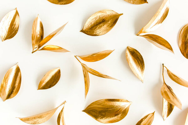 Pattern, texture with gold leaves isolated on white background. flat lay, top view