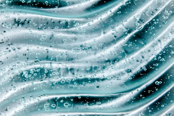 Gel alla panna liquido, texture cosmetica blu verde con bolle — Foto Stock
