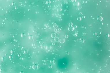 Sıvı krem jöle, köpüklü yeşil mavi kozmetik doku.