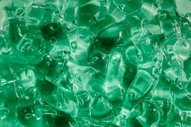 Sıvı krem jöle, köpüklü yeşil mavi kozmetik doku.