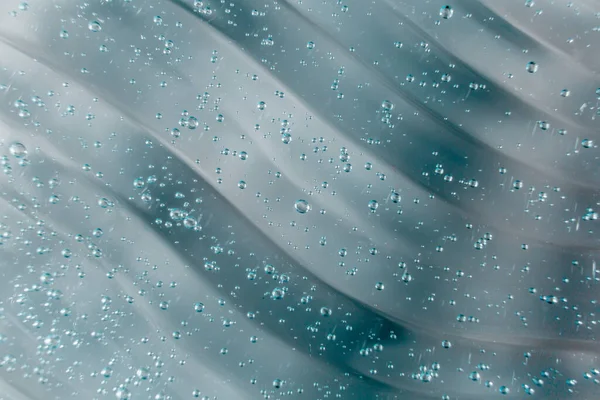 Gel líquido crema, textura cosmética azul verde con burbujas — Foto de Stock