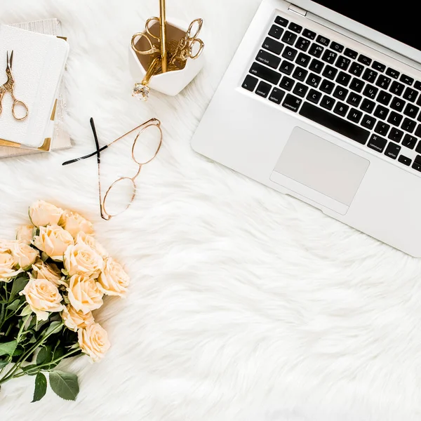 Female workspace with laptop, roses flowers, golden accessories, diary, computer, glasses on white background. Flat lay womens office desk. Top view — Stock Photo, Image