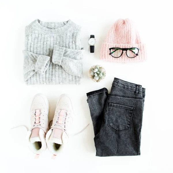 Women fashion clothes and accessories. Feminine youth collage, top view. Flat lay female style look with warm sweater, jeans, cap, sneakers. Top view. — Stock Photo, Image