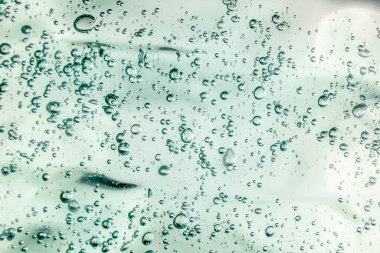 Sıvı krem jöle, köpüklü yeşil mavi kozmetik doku.