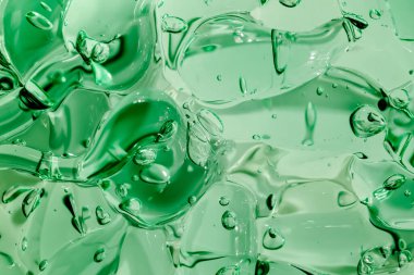 Sıvı krem jöle, köpüklü yeşil mavi kozmetik doku.