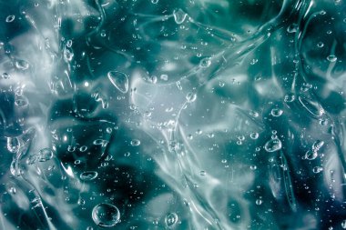 Sıvı krem jöle, köpüklü yeşil mavi kozmetik doku.