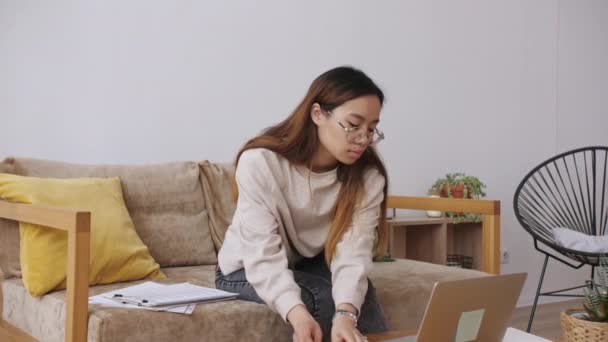 Middle Eastern female remote working from home, having a video call with colleagues, checking documents. Stay home, quarantine remote work. Slow motion. — Stock Video