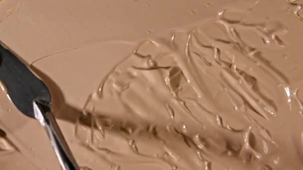 Foundation for face, smear, concealer, cosmetic liquid foundation, make-up smudge or cream beige color smudge, makeup brush. Motion, rotation of the beauty skincare product sample. Macro Shot — Stock Video