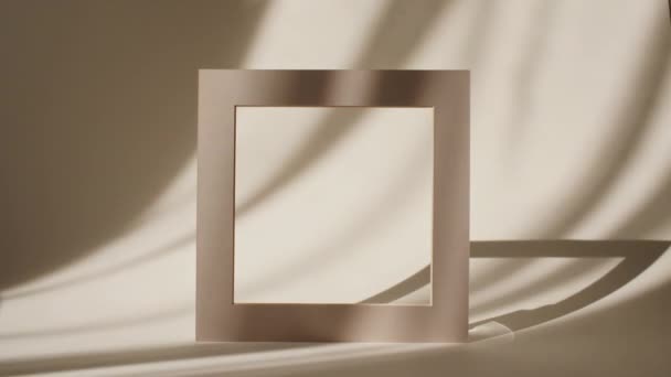 Geometry Frame for Show Product Display on Pastel Beige Background in the Morning Rays of Light and Shadows. Abstract Minimal Mock up Scene for Product Presentation. Stage Pedestal or Platform. — Stock Video
