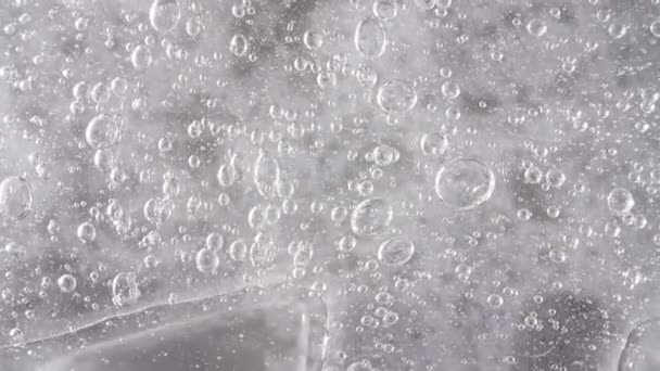 Transparent Cosmetic Gel Cream With Molecule Bubbles. Top view. Macro Shot — Stock Video