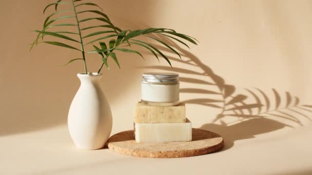 Pastel Beige Stage, Pedestal or Podium From Bars of Soap in Sun Light. Presentation, Advertising with of Beauty Cream on Pastel Beige Background in the Morning Rays of Light and Palm Leaves Shadows. — Stock Video