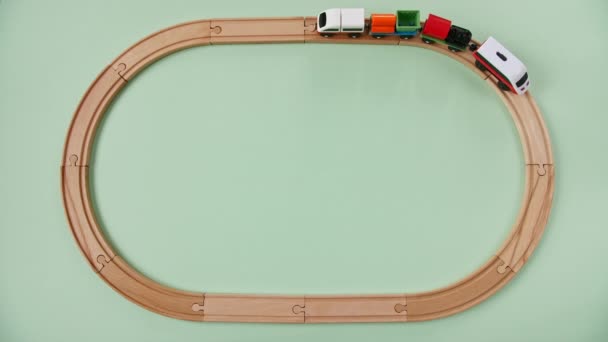 Childish Toy Wooden Railway. Toy Train Travel Along the Ring Railway. Childs Educational Toys. Top View. Copy Space. — Stock Video