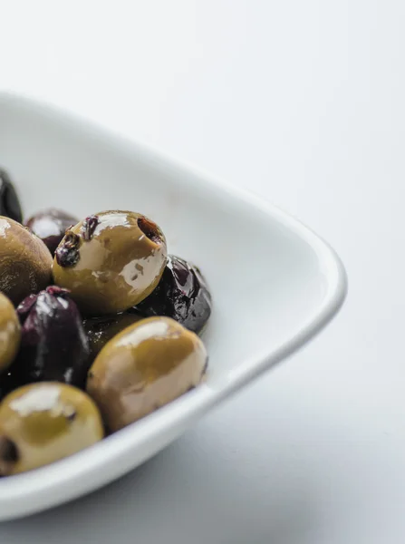 Mixed olives in white bowl — Stock Photo, Image