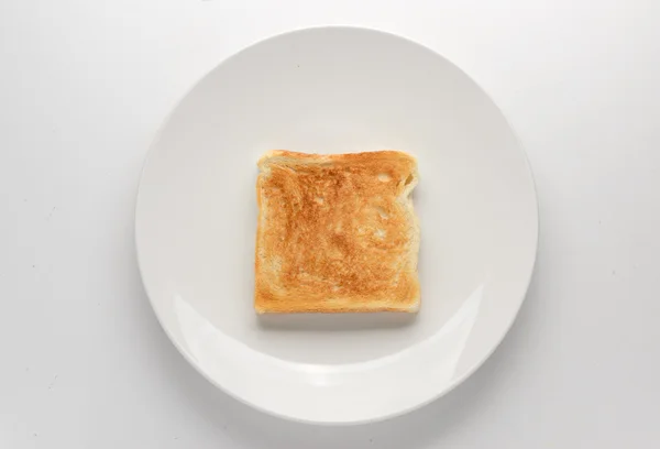Pirított szelet kenyér, fehér lemez — Stock Fotó