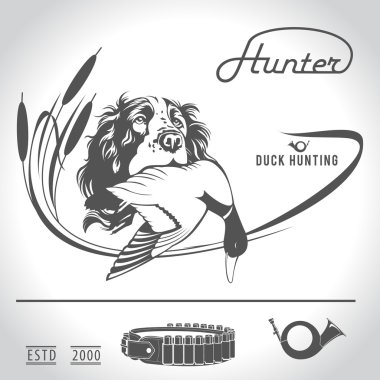 Hunting logo hunting dog with a wild duck in his teeth and desig clipart