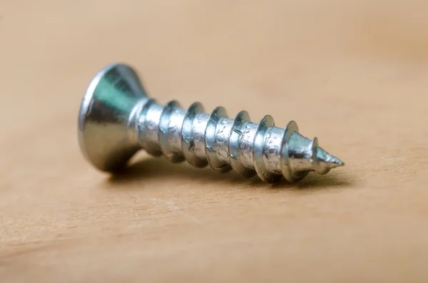 Screws on the plywood — Stock Photo, Image