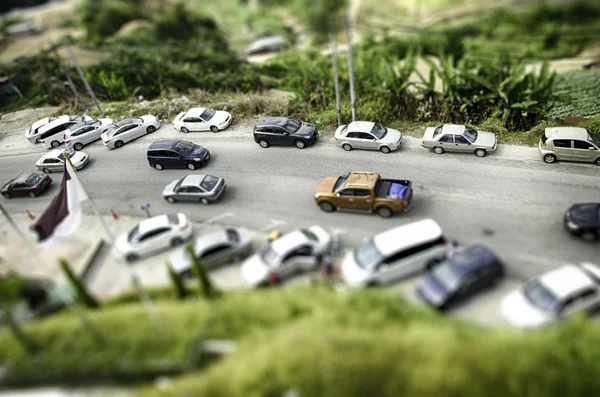 Tilt shift effect from aerial view, group of car park at garden — Stock Photo, Image