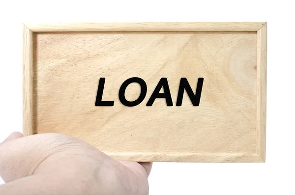 Business and advertising concept. hand holding plain wood with word loan — Stock Photo, Image