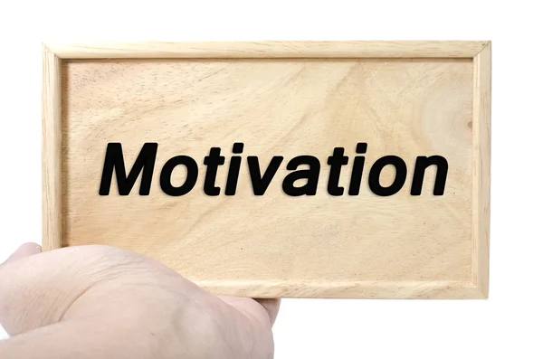 Geschäfts- und Motivationskonzept. Hand hält schlichtes Holz mit Wortmotivation — Stockfoto