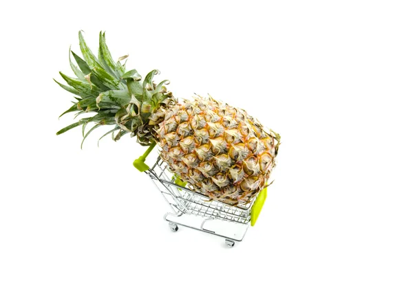 Fresh pineapple on trolley isolated white background — Stockfoto