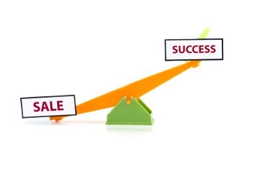 image concept of unbalance word sale at bottom and success on top.green and orange colour toy seesaw